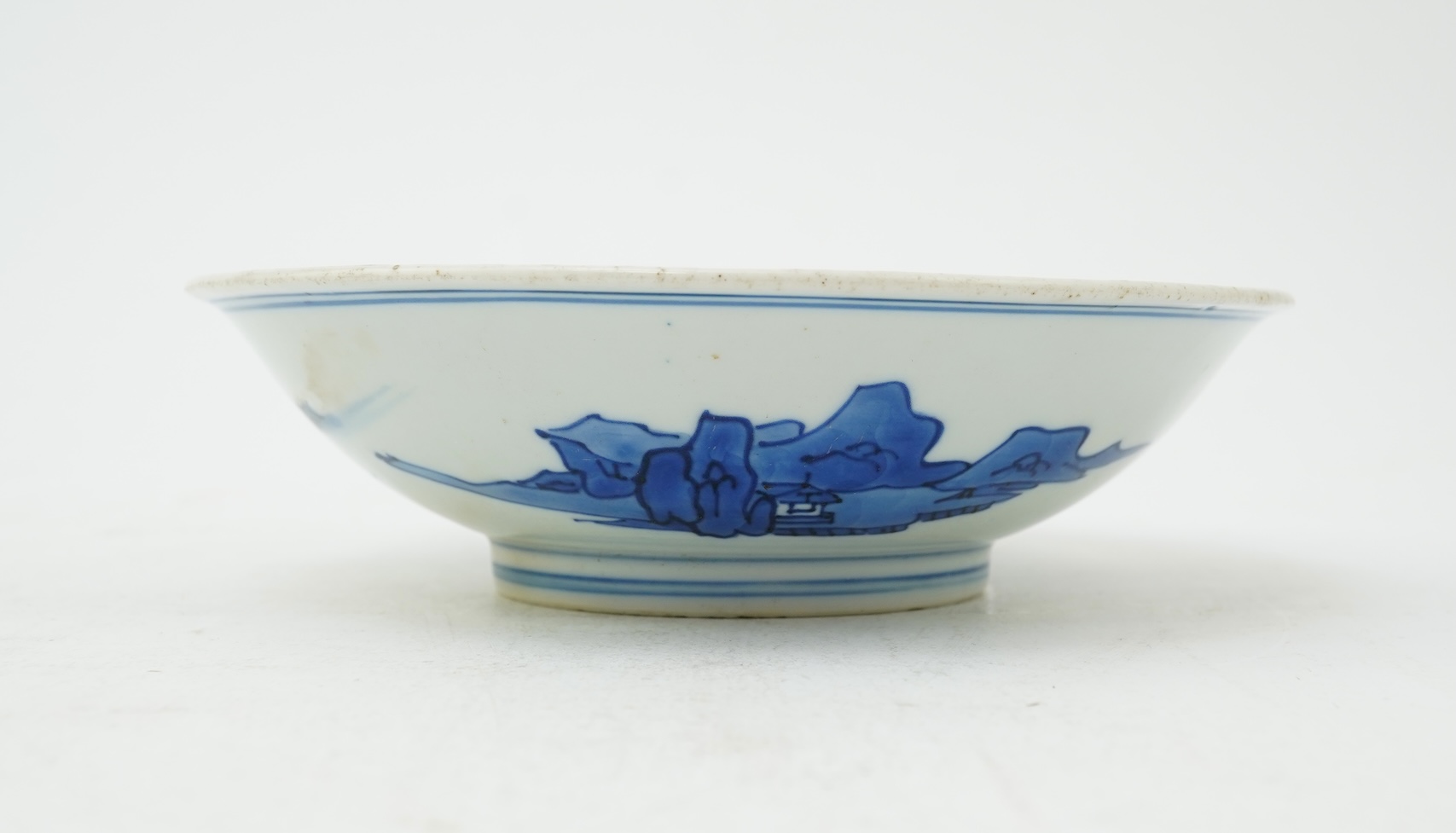 A Chinese blue and white saucer dish, Kangxi six character mark and of the period (1662-1722)